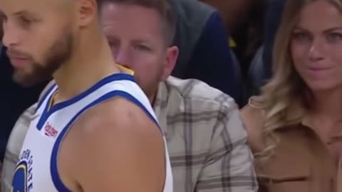 Women courtside bit lips after Stephen Curry looked at her