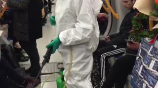 Woman in white hazmat outfit black boots