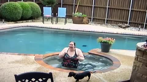 Surprise Splash While Helping a Doggy Into the Pool