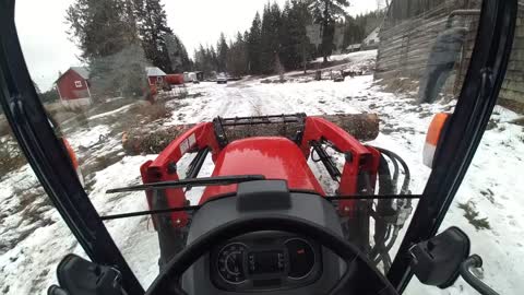 Massey 1735M moving logs.