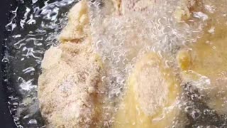 Frying tasty chicken in a pan