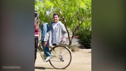 A man on a bicycle shows strange talents