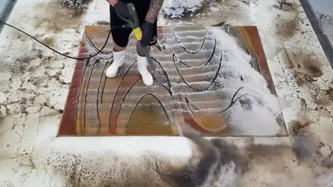 Washing a very dirty carpet with orange waves Speeded Up