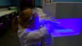 girl plays doctor toys