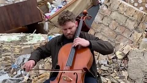 Ukraine War - a man played cello in the ruins of Kyiv