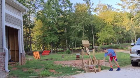 Kid's Homemade Trebuchet Lands Trick Shot Into Wheelbarrow