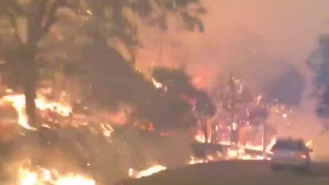 Terrifying video shows California deputy driving through flames after evacuating residents