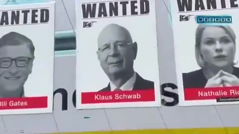 Wanted posters for Great Reset criminals being displayed in style at a protest. Who should be added?