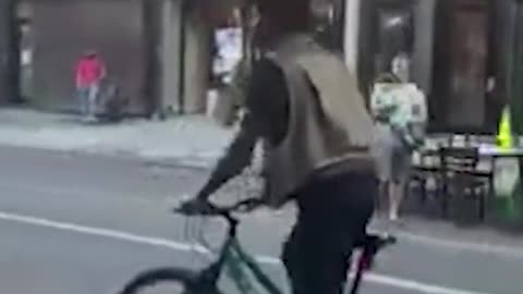 Man balances suitcase on his head while cycling in US. Watch video