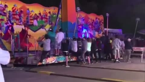 Carnival ride malfunctions, people run to prevent it from tipping over