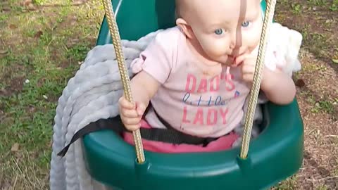 Sweet baby on swing