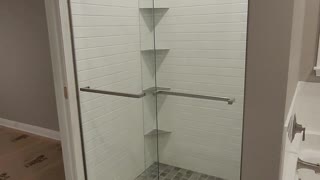 Dreamline door, custom tile shower, schluter shelves, trim, tile tub surround, laticrete waterproofing