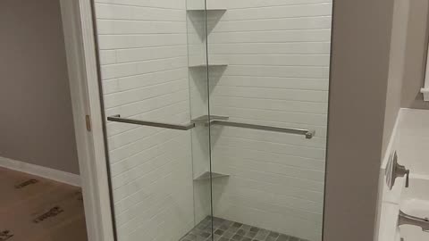 Dreamline door, custom tile shower, schluter shelves, trim, tile tub surround, laticrete waterproofing