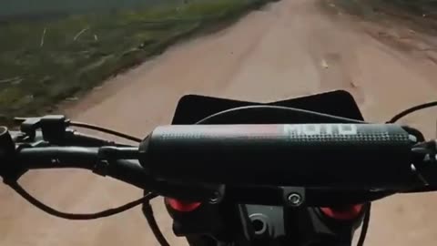 Russian soldier on a motorcycle records a Russian SU-25 flying low