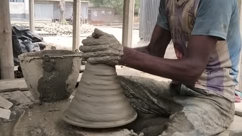 Making pots with mud