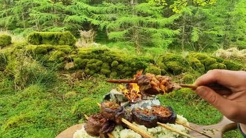 Beef cooked in the wild forest