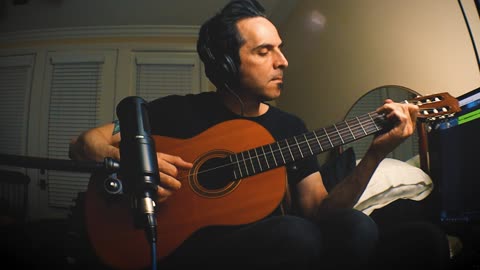 Instrumental in Em, tapping on a nylon string/ classical guitar