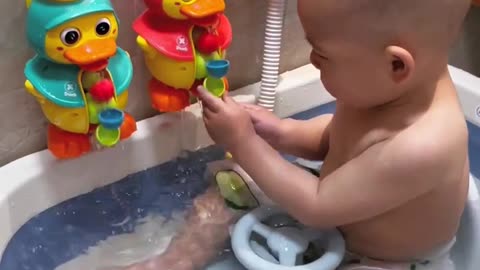 Baby enjoying the bath.