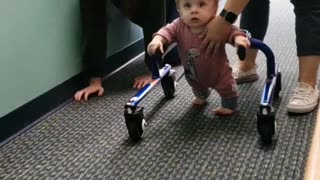 Precious little boy with dwarfism learns how to walk