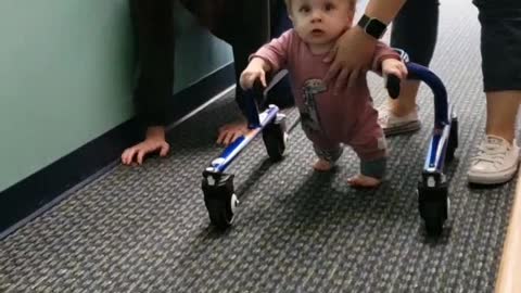 Precious little boy with dwarfism learns how to walk