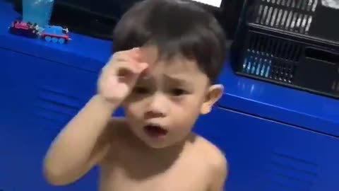Little boy bangs his head while dancing
