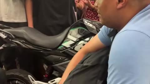 Funniest guy taking a motorbike on commuter train riding?