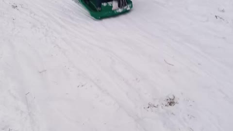 Snow boarding on a sled 2