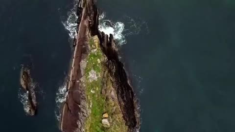 Nautical landscape shot by drone taking off along the coast