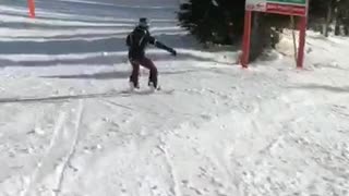Skier in black skier in grey crash into each other