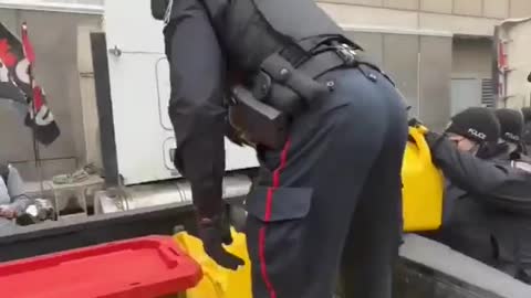 OTTAWA POLICE CONFISCATING FUEL AND CONTAINERS FROM THE CONVOY FOR FREEDOM TRUCKERS