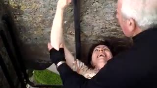 Kissing the Blarney Stone at Cork, Ireland