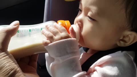 The baby angel is drinking milk