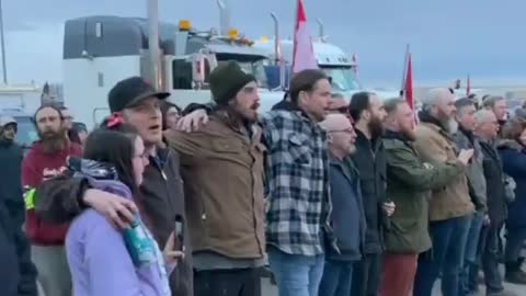Day 18 of the Coutts border blockade, police and protesters hug, shake hands and sing the national anthem together