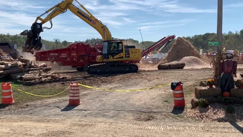 Komatsu Excavator Moving Logs