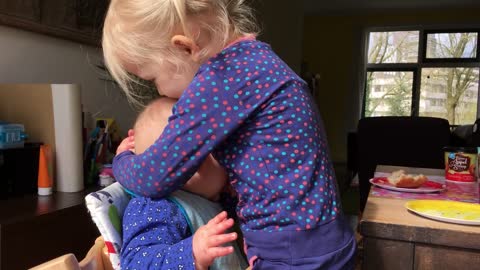 This Baby Cuddling With Her Sister Will Melt Your Heart