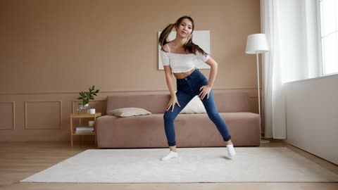 A Woman Dancing At Home