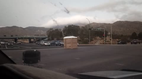 Porta Potty Passes Through Busy Intersection