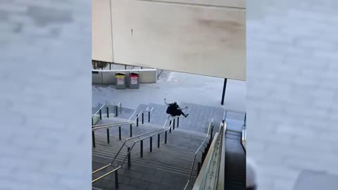 Guy Slides Down A Handrail On His Behind