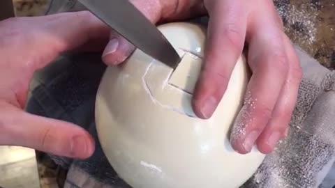 Guy cuts open ostrich egg and chugs/shotguns it in kitchen