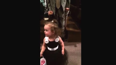 Precious Flower Girl Sees Dad While Going Down The Isle, Stops To Say Hi