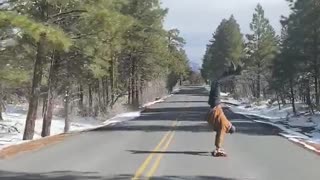 Man Handstands on Longboard down Grand Canyon Roadway