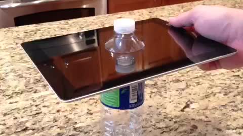 Drilling through an iPad with a water bottle