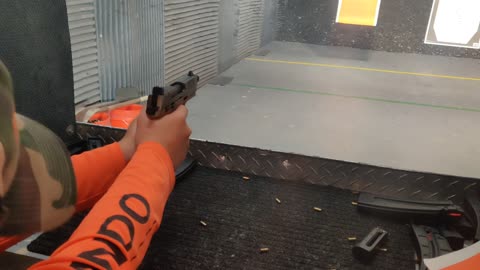 Alex's first time at the range .22 pistol.