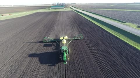 Modern tractor working in the field