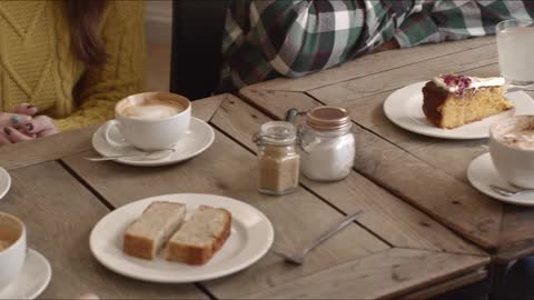 Cafe Table with Coffee and Cakes