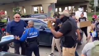 BREAKING: Cops Intervene As Man Attempts to Break Up Radical Leftist Blockade in Texas