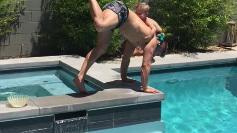 Acrobat dad risks dangerous workout with son