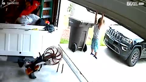 Toddler hitches lift on garage door