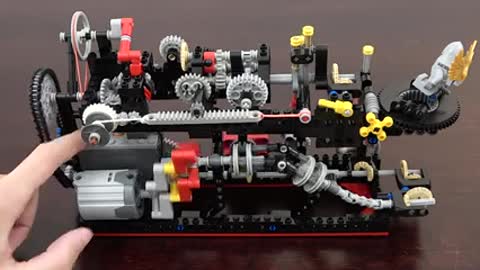 20 Mechanical Principles combined in a Useless Lego Machine