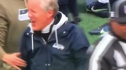 Pete Carroll get a flag for bumping into an official